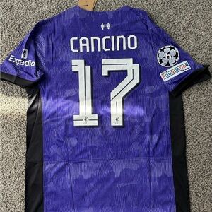 purple Nike Liverpool 2023/24 third jersey with "CANCINO"